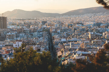 Obraz premium Piraeus city, Attica, beautiful panoramic view of Piraeus, Greece, with harbour and port, mountains and scenery beyond the city, seen from Prophet Helias Hill on Kastela Hill, sunset summer view