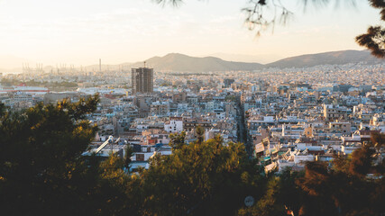 Piraeus city, Attica, beautiful panoramic view of Piraeus, Greece, with harbour and port, mountains and scenery beyond the city, seen from Prophet Helias Hill on Kastela Hill, sunset summer view