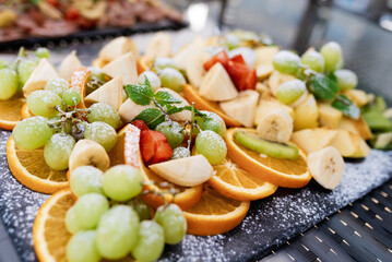 assorted fresh cut fruits on a tray