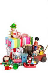 Wooden vintage Christmas toys and gifts on a white background.
