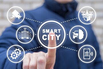 Businessman using virtual touch screen presses inscription: SMART CITY. Smart city with smart services, internet of things, networks and augmented reality concept.