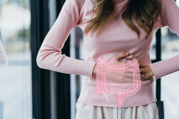 woman hands touching on stomach with intestine virtual icon, probiotics food for gut health, colon...
