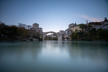 Fototapeta na wymiar Mostar bridge touristical destination unesco worid heritage with blue sky and lights