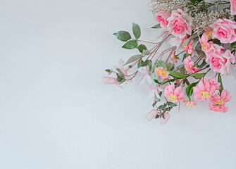 Flowers in pink tones, white background, copy space. Suitable for use in the form of a frame.