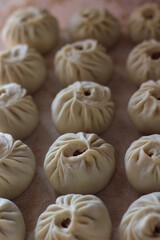 Traditional Buryad Cuisine Food with Chopped Meat and Dough. Preparing Making Dumplings Close-up	
