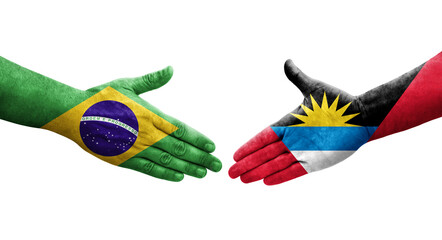 Handshake between Antigua and Barbuda and Brazil flags painted on hands, isolated transparent image.