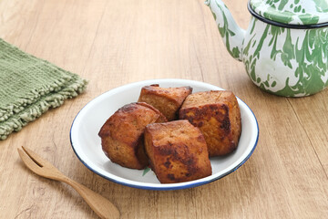 Tahu Bacem, traditional food from Central Java, Indonesia, cooked with spices, palm sugar and coconut water. Boil, then fry briefly.
