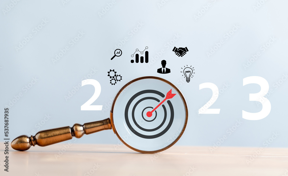 Poster Target business on 2023 year concept. Magnifier focus to dartboard icon. planning project, invest, innovation, idea to next year from end 2022, New year concept.