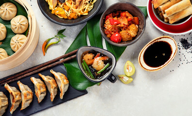 Assorted Chinese food on dark background. Asian food concept. Top view.