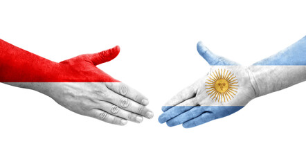 Handshake between Argentina and Indonesia flags painted on hands, isolated transparent image.