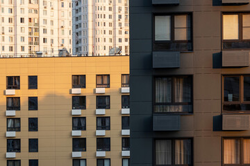 Fragments of facades of various buildings close-up. Dense urban development. Aerial view.