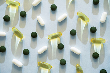 Some pills, vitamin capsules or dietary supplement supports for health.