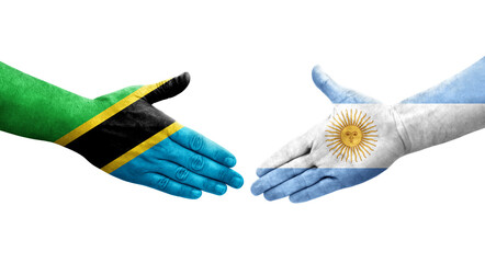 Handshake between Argentina and Tanzania flags painted on hands, isolated transparent image.