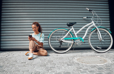 Bike, young woman and with phone in city relax, with bicycle and happy texting, social media apps...