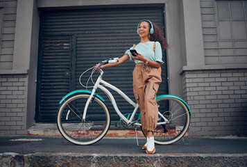 Bicycle, phone and happy woman with headphones for music while on walk in the city street....