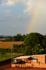 A rainbow above large soybean fields on once forested lands on the outskirts of the small town of Cabixi, Rondonia state, Brazil