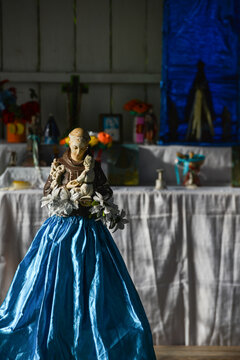 An image of Santo Antonio, or Saint Anthony, and a simple altar in the Quilombo of Santo Antonio, a settlement founded mainly by descendants of escaped slaves, Rondonia state, Brazil