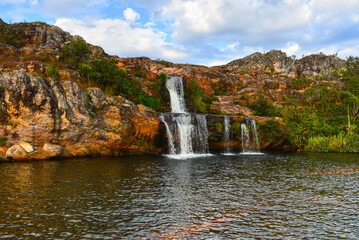 Fototapeta na wymiar Late afternoon in the Cachoeira dos Cristais waterfall, near the historic village of Biribiri, Diamantina, Minas Gerais state, Brazil