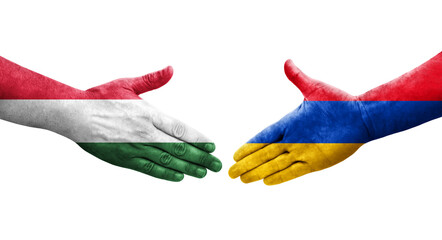 Handshake between Armenia and Hungary flags painted on hands, isolated transparent image.