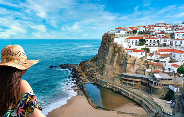 Woman contemplating the view of the beach in Azenhas do Mar, Lisbon, Sintra, Portugal - Travel...