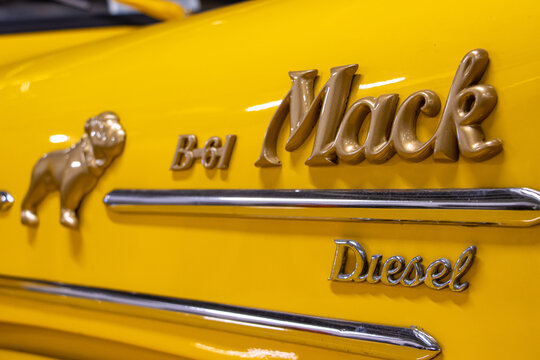  The Mack brand logo on the engine hood of the truck
