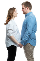 A young pregnant woman and a man are hugging. Happiness in anticipation of the baby by parents. Love and tenderness. White background. Vertical.