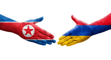 Handshake between Armenia and North Korea flags painted on hands, isolated transparent image.