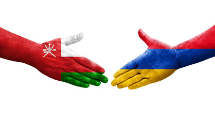 Handshake between Armenia and Oman flags painted on hands, isolated transparent image.