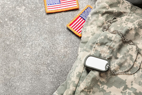 Military uniform, tag and chevrons of USA army on grunge background