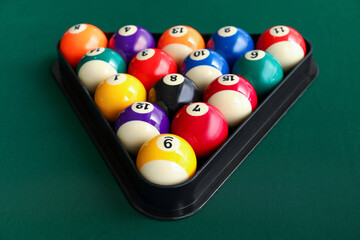Naklejka premium Billiard balls in triangle on table