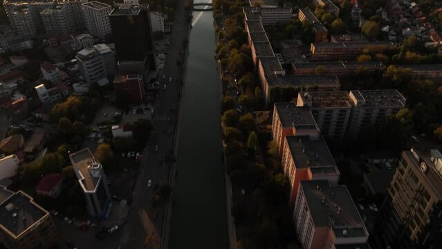 Fly Over The Dambovita River Near Orhideea Towers During Sunset In The City Of Bucharest, Romania. Aerial Drone Shot