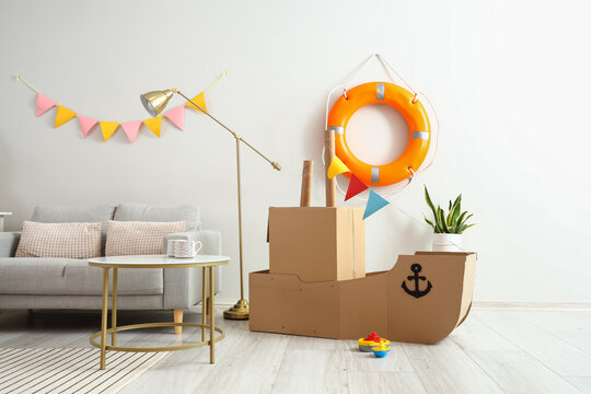 Interior of children's room with toy cardboard ship