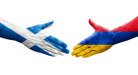 Handshake between Armenia and Scotland flags painted on hands, isolated transparent image.