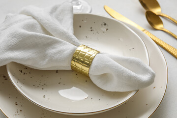 Closeup view of napkin in plate on white table