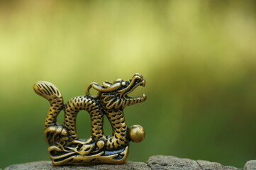 Dragon figurine close-up. Chinese symbol. Esotericism and feng shui.