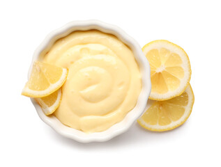 Ramekin of delicious vanilla pudding and lemon on white background