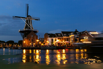 Fototapeta na wymiar Historic Windmill de Adriaan in the old city centre of Haarlem, Netherlands