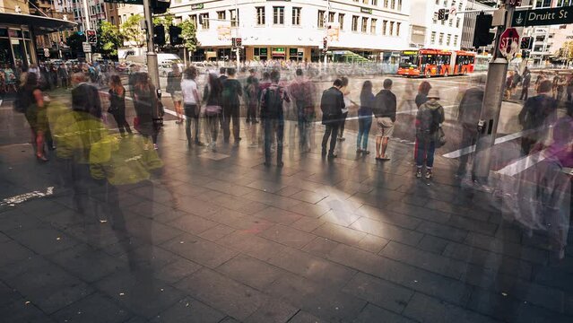 Pedestrian traffic at a busy road crossing, Sydney, Australia - smart blur time lapse