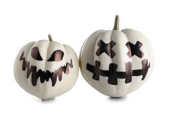 Halloween pumpkins with drawn face on white background