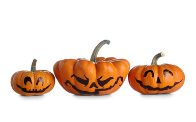 Orange Halloween pumpkins with drawn face on white background