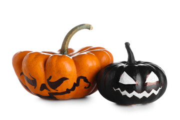 Halloween pumpkins with drawn face on white background