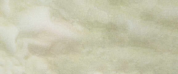Sand background, texture. Dry beige sandy beach Greek islands, Cyclades. Empty, copy space, banner