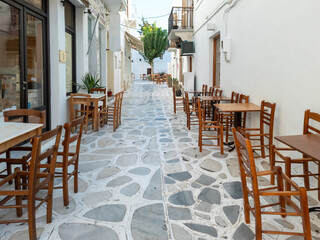 Greek outdoors traditional tavern restaurant at Tinos island, Chora town, Cyclades Greece.
