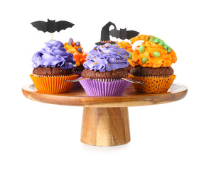 Stand with tasty Halloween cupcakes on white background