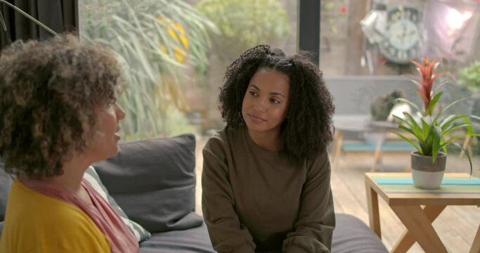 Smiling African American woman resolving her problems at Therapy