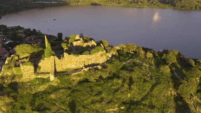 Amazing Orbiting Shot Above Orsinis Fortress on Lake Bracciano, Italy. Sunset