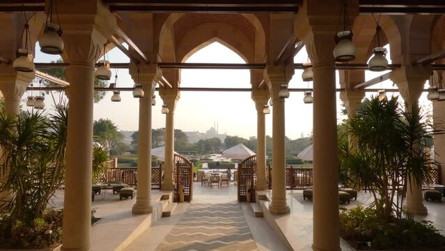 Scenic Archway entrance at the Al-Azhar Park with people passing by in background, Arabic style architectonics