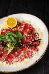 delicious veal carpaccio on a plate