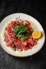 delicious veal carpaccio on a plate