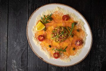 delicious salmon carpaccio on a plate